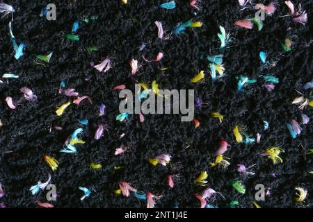 Colorful dark hand made crochet or knitting textile fabric texture. Close up macro background. Stock Photo
