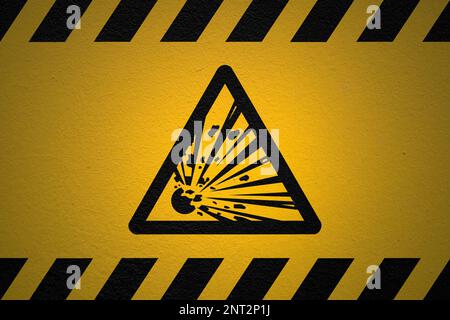 Black striped yellow background with a Danger Explosive sign and a light effect to dramatize the whole. Stock Photo
