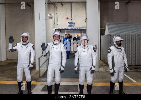 Cape Canaveral, United States of America. 23 February, 2023. Astronauts from left; Andrey Fedyaev of Roscosmos, Woody Hoburg, and Stephen Bowen, of NASA, and Sultan Alneyadi of the United Arab Emirates depart the Checkout Building for launch at the Kennedy Space Center, February 26, 2023 in Cape Canaveral, Florida. The NASA SpaceX Crew-6 mission to the International Space Station was scrubbed after a problem with the TEA-TEB ground system was detected delaying launch until March 2nd. Credit: Brandon Garner/NASA/Alamy Live News Stock Photo