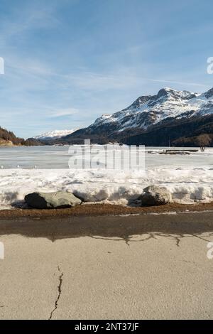 Silvaplana, Switzerland, February 21, 2023 Stunning winter landscape scenery with a frozen lake of Silvaplana Stock Photo