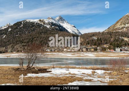 Silvaplana, Switzerland, February 21, 2023 Stunning winter landscape scenery with a frozen lake of Silvaplana Stock Photo