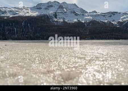 Silvaplana, Switzerland, February 21, 2023 Stunning winter landscape scenery with a frozen lake of Silvaplana Stock Photo