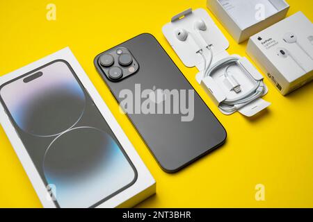 New iPhone 14 pro max and Apple Earpods, Airpods white earphones in an open  box. Isolated colorful background Stock Photo - Alamy