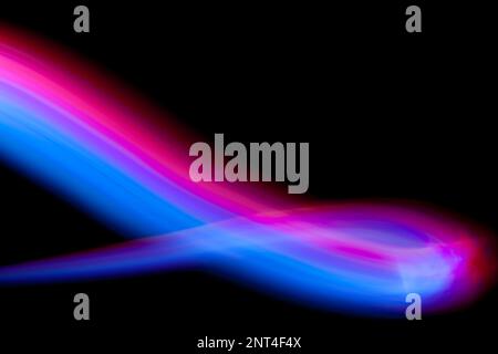 Abstract light painting forming a curve on a black background. Stock Photo