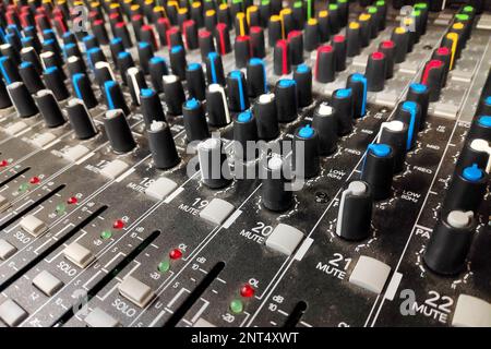Close-up on the rows of buttons from a mixing board. Stock Photo