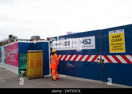 Euston, London, UK. 27th February, 2023. HS2 Ltd are doing vast amounts of construction for the new High Speed Rail 2 London Euston railway station terminus and London Underground interchange. HS2 started utility diversions in the Euston Road last week which is now slowing down traffic. Residents living in the Euston area are having to endure HS2 noise, dust and disruption that one resident  described today as 'hell on earth with no end in sight'. Credit: Maureen McLean/Alamy Live News Stock Photo