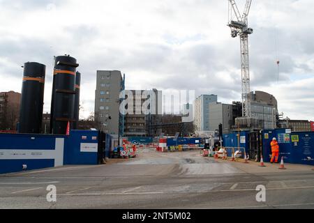 Euston, London, UK. 27th February, 2023. HS2 Ltd are doing vast amounts of construction for the new High Speed Rail 2 London Euston railway station terminus and London Underground interchange. HS2 started utility diversions in the Euston Road last week which is now slowing down traffic. Residents living in the Euston area are having to endure HS2 noise, dust and disruption that one resident  described today as 'hell on earth with no end in sight'. Credit: Maureen McLean/Alamy Live News Stock Photo