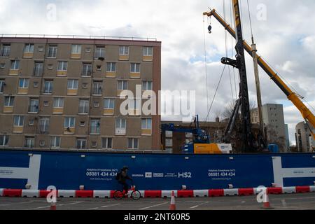 Euston, London, UK. 27th February, 2023. HS2 Ltd are doing vast amounts of construction for the new High Speed Rail 2 London Euston railway station terminus and London Underground interchange. HS2 started utility diversions in the Euston Road last week which is now slowing down traffic. Residents living in the Euston area are having to endure HS2 noise, dust and disruption that one resident  described today as 'hell on earth with no end in sight'. Credit: Maureen McLean/Alamy Live News Stock Photo