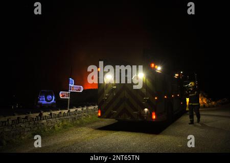 Bantry, West Cork, Ireland. 27th February, 2023. The gorse fire season has recently started in West Cork, pictured below: Seskin Hill in Bantry is in massive flames. Credit: Karlis Dzjamko/ Alamy Live News Stock Photo