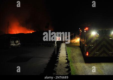 Bantry, West Cork, Ireland. 27th February, 2023. The gorse fire season has recently started in West Cork, pictured below: Seskin Hill in Bantry is in massive flames. Credit: Karlis Dzjamko/ Alamy Live News Stock Photo