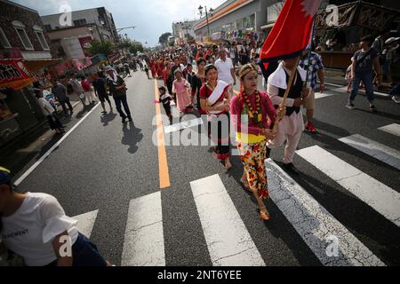 Nepalese residents take part in the parade during the Oizumi 