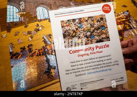 The Stavros Niarchos Foundation Library (SNFL) at 455 Fifth Avenue, has a community jigsaw puzzle, New York City, USA 2023 Stock Photo