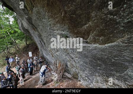 A ritual event of Ainu people 'Kamuinomi' is held to pray for the safety of the mountain by dedicating the cranial bone of a bear on a huge rock in the mountain in Eniwa City, Hokkaido Prefecture, northern Japan on July 7, 2019. The Ainu in the historical Japanese texts the Ezo, are an indigenous people of Hokkaido, formerly northeastern Honshu of Japan, Sakhalin, the Kuril Islands, and the Kamchatka Peninsula on Russia. Kamuinomi is a ceremony to return the Kamui (godhead, godhood, godship) to the heavenly world. ( The Yomiuri Shimbun via AP Images )