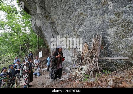 A ritual event of Ainu people 'Kamuinomi' is held to pray for the safety of the mountain by dedicating the cranial bone of a bear on a huge rock in the mountain in Eniwa City, Hokkaido Prefecture, northern Japan on July 7, 2019. The Ainu in the historical Japanese texts the Ezo, are an indigenous people of Hokkaido, formerly northeastern Honshu of Japan, Sakhalin, the Kuril Islands, and the Kamchatka Peninsula on Russia. Kamuinomi is a ceremony to return the Kamui (godhead, godhood, godship) to the heavenly world. ( The Yomiuri Shimbun via AP Images )