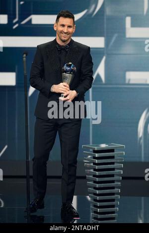 Paris, France. 27th Feb, 2023. Argentina's Lionel Messi reacts after receiving the Best FIFA Men's Player Award during the Best FIFA Football Awards 2022 ceremony in Paris, France, Feb. 27, 2023. Credit: Glenn Gervot/Xinhua/Alamy Live News Stock Photo