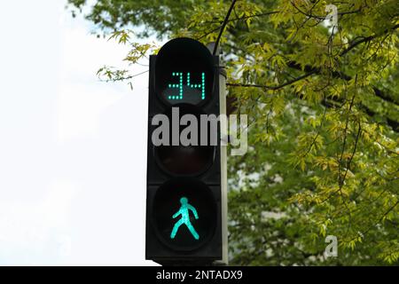 Modern traffic light with timer in city Stock Photo