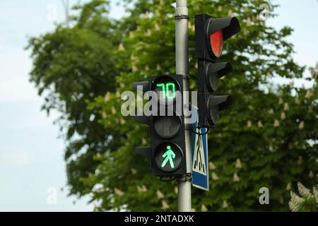 View of modern traffic lights on city street Stock Photo