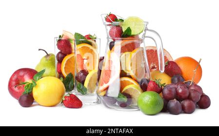 Jug and glasses with different fruits on white background Stock Photo