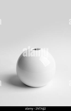 Stylish white ceramic vase on light background Stock Photo