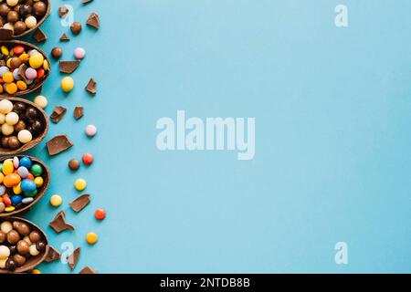 Halves chocolate eggs with sweets Stock Photo