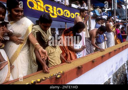 Ezhuthiniruthu Ceremony on Vijayadasami day in Saraswathi Temple at Panachikadu near Kottayam, Kerala, South India, India, Asia Stock Photo