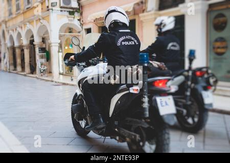 Greek police squad formation on duty riding bike and motorcycle and maintain public order in the streets of Kerkyra, Corfu, Greece, group of policemen Stock Photo