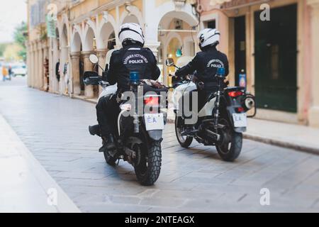 Greek police squad formation on duty riding bike and motorcycle and maintain public order in the streets of Kerkyra, Corfu, Greece, group of policemen Stock Photo