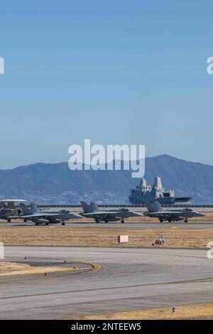 U.S. Navy F/A-18E Super Hornets stage during a capabilities demonstration at Marine Corps Air Station Iwakuni, Japan, Feb. 27, 2023. The demonstration included a U.S. Marine Corps UC-12W Huron assigned to Headquarters and Headquarters, MCAS Iwakuni; two F-35B Lightning IIs and a KC-130J Super Hercules assigned to Marine Aircraft Group (MAG) 12, 1st Marine Aircraft Wing (MAW); three U.S. Navy F/A-18E Super Hornets, an F/A-18F Super Hornet, EA-18G Growler, E-2 Hawkeye, and C-2 Greyhound assigned to Carrier Air Wing (CVW) Five; and one JMSDF US-2,  EP-3, OP-3C, UP-3D, U-36A, and MCH-101 assigned Stock Photo