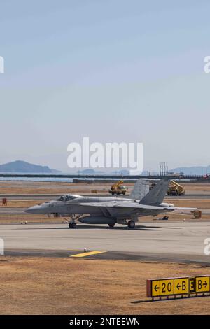 A U.S. Navy F/A-18E Super Hornet taxis off the runway following a capabilities demonstration at Marine Corps Air Station Iwakuni, Japan, Feb. 27, 2023. The demonstration included a U.S. Marine Corps UC-12W Huron assigned to Headquarters and Headquarters, MCAS Iwakuni; two F-35B Lightning IIs and a KC-130J Super Hercules assigned to Marine Aircraft Group (MAG) 12, 1st Marine Aircraft Wing (MAW); three U.S. Navy F/A-18E Super Hornets, an F/A-18F Super Hornet, EA-18G Growler, E-2 Hawkeye, and C-2 Greyhound assigned to Carrier Air Wing (CVW) Five; and one JMSDF US-2,  EP-3, OP-3C, UP-3D, U-36A, an Stock Photo