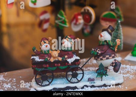 Christmas market details with New Year decorations and multicolored flags, garlands and festoons, Xmas atmosphere, fair interior, retail and store wit Stock Photo