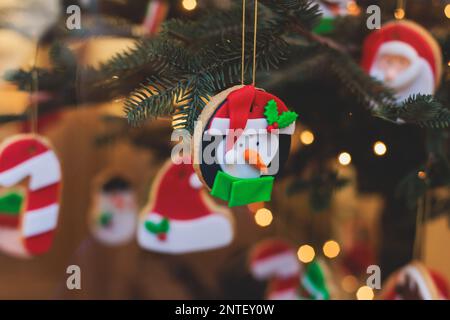 Christmas market details with New Year decorations and multicolored flags, garlands and festoons, Xmas atmosphere, fair interior, retail and store wit Stock Photo
