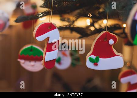 Christmas market details with New Year decorations and multicolored flags, garlands and festoons, Xmas atmosphere, fair interior, retail and store wit Stock Photo