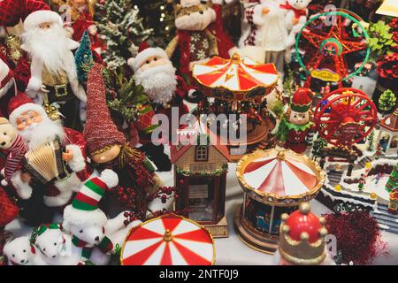 Christmas market details with New Year decorations and multicolored flags, garlands and festoons, Xmas atmosphere, fair interior, retail and store wit Stock Photo