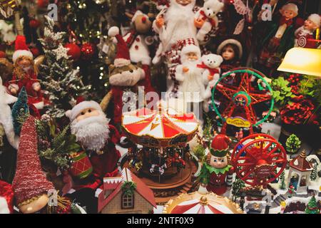 Christmas market details with New Year decorations and multicolored flags, garlands and festoons, Xmas atmosphere, fair interior, retail and store wit Stock Photo