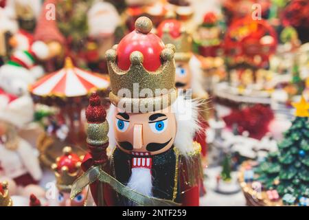 Christmas market details with New Year decorations and multicolored flags, garlands and festoons, Xmas atmosphere, fair interior, retail and store wit Stock Photo