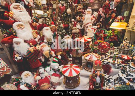 Christmas market details with New Year decorations and multicolored flags, garlands and festoons, Xmas atmosphere, fair interior, retail and store wit Stock Photo