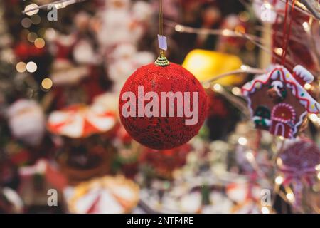 Christmas market details with New Year decorations and multicolored flags, garlands and festoons, Xmas atmosphere, fair interior, retail and store wit Stock Photo
