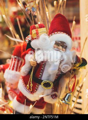 Christmas market details with New Year decorations and multicolored flags, garlands and festoons, Xmas atmosphere, fair interior, retail and store wit Stock Photo