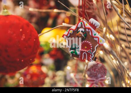 Christmas market details with New Year decorations and multicolored flags, garlands and festoons, Xmas atmosphere, fair interior, retail and store wit Stock Photo