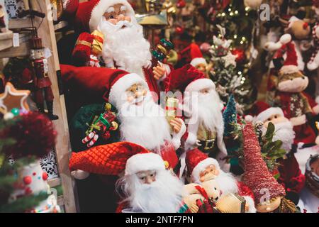 Christmas market details with New Year decorations and multicolored flags, garlands and festoons, Xmas atmosphere, fair interior, retail and store wit Stock Photo