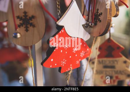 Christmas market details with New Year decorations and multicolored flags, garlands and festoons, Xmas atmosphere, fair interior, retail and store wit Stock Photo