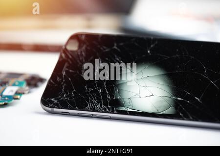 close up cracked screen on broken smart phone. Stock Photo