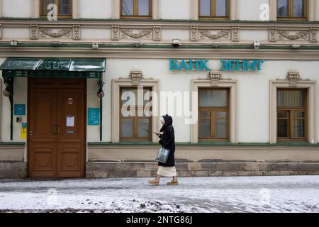 Moscow, Russia. 27th Feb, 2023. A woman walks past the office of the Zenit Bank in Moscow. The UK blacklisted the bank blocking the bankís accounts and assets in the United Kingdom and prohibiting its citizens and businesses from engaging in any transactions with the bank. (Photo by Vlad Karkov/SOPA Images/Sipa USA) Credit: Sipa USA/Alamy Live News Stock Photo