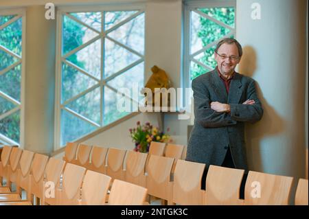 PRODUCTION - 24 February 2023, Saxony-Anhalt, Halle (Saale): Catholic priest Magnus Koschig stands in Halle's Heilig Kreuz church. The 62-year-old assumes that in just ten years there will be only 20 priests in the Magdburg diocese instead of the current 55 due to aging. (to dpa 'Fewer priests, more laity: Catholic diocese in transition') Photo: Heiko Rebsch/dpa Stock Photo