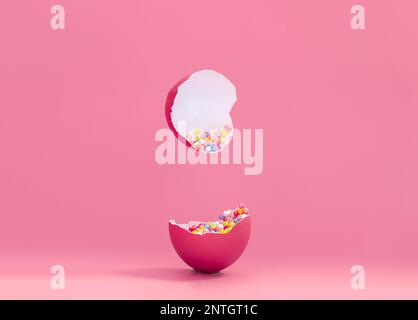 Broken decorative easter egg with colorful confetti. Minimal composition, painted egg magenta color on pastel pink background. Space for text Stock Photo