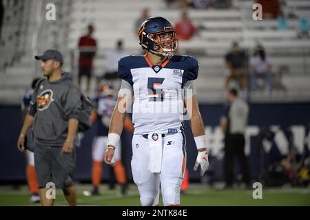 Orlando Apollos quarterback Austin Appleby (5) and offensive lineman Ronald  Patrick (71) warm up before an