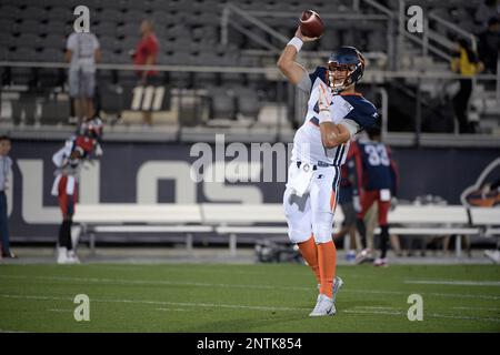 Orlando Apollos quarterback Austin Appleby (5) and offensive lineman Ronald  Patrick (71) warm up before an