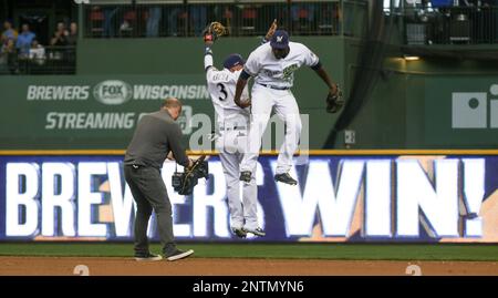 Milwaukee Brewers' Lorenzo Cain and Orlando Arcia smile during the