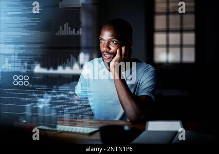 Locating the bug and fixing it swiftly. Shot of a programmer working on a computer code at night. Stock Photo