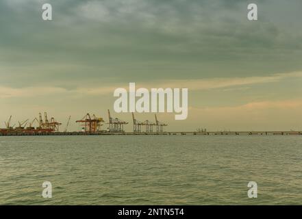 View of a working deep sea port in vintage colors, Loading and unloading of cargo ships. Stock Photo
